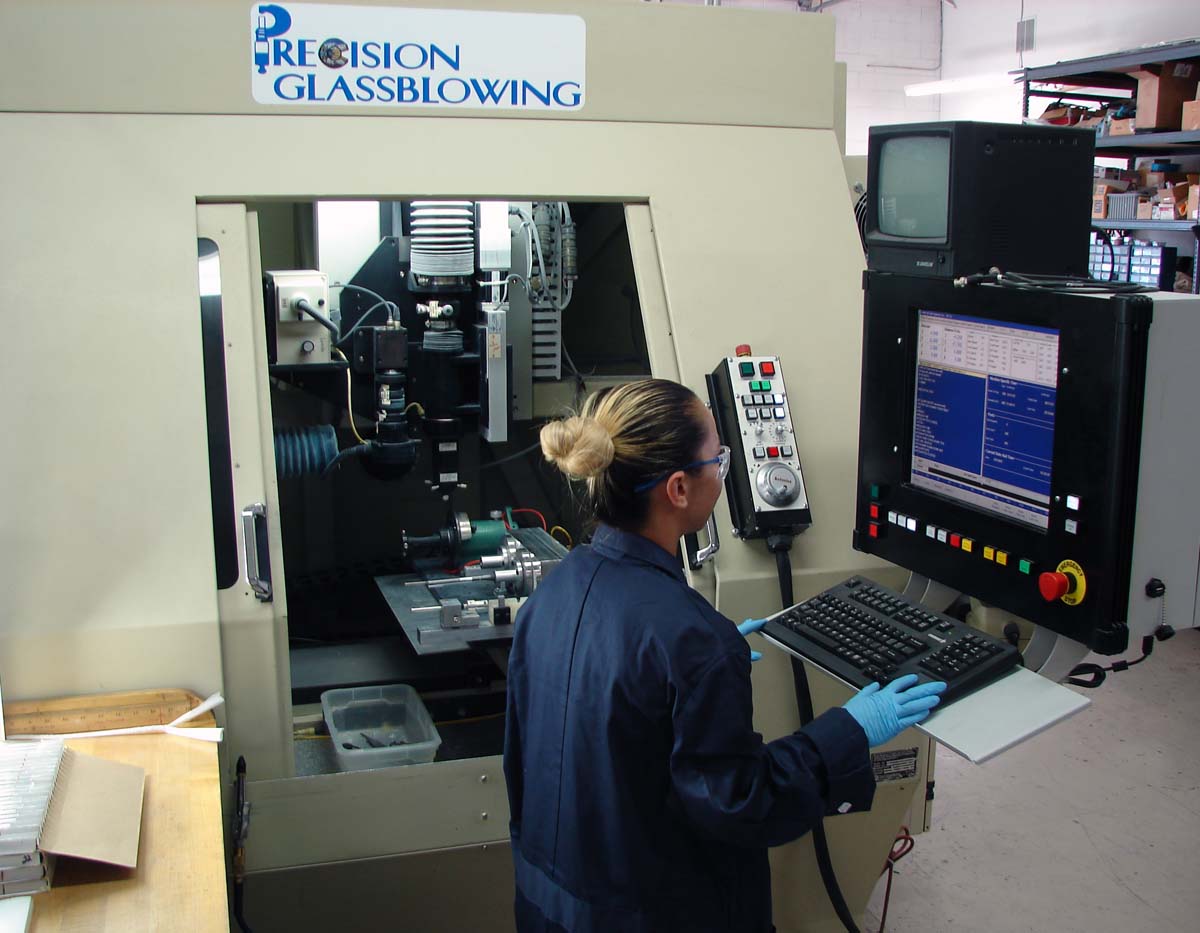 Making good use of sustainable energy, this technician uses a laser to shape glass.