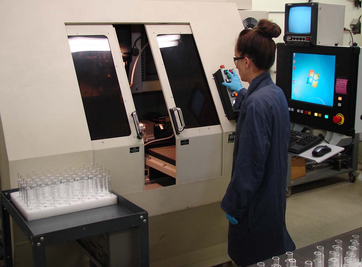 A woman demonstrates glass cutting speed.